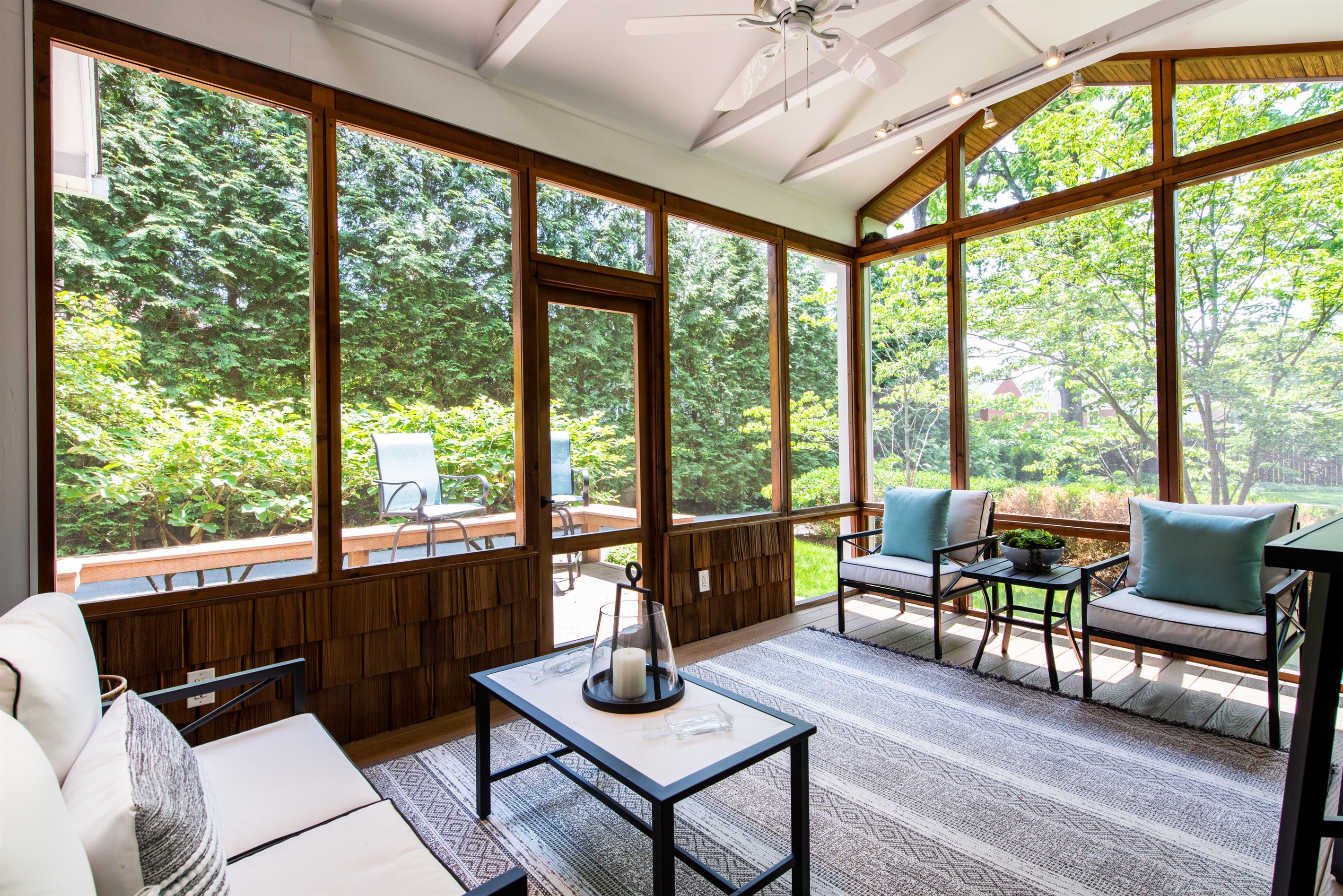 Enjoy our serene sunroom with high-end furnishings, steps from Triple Crown farms