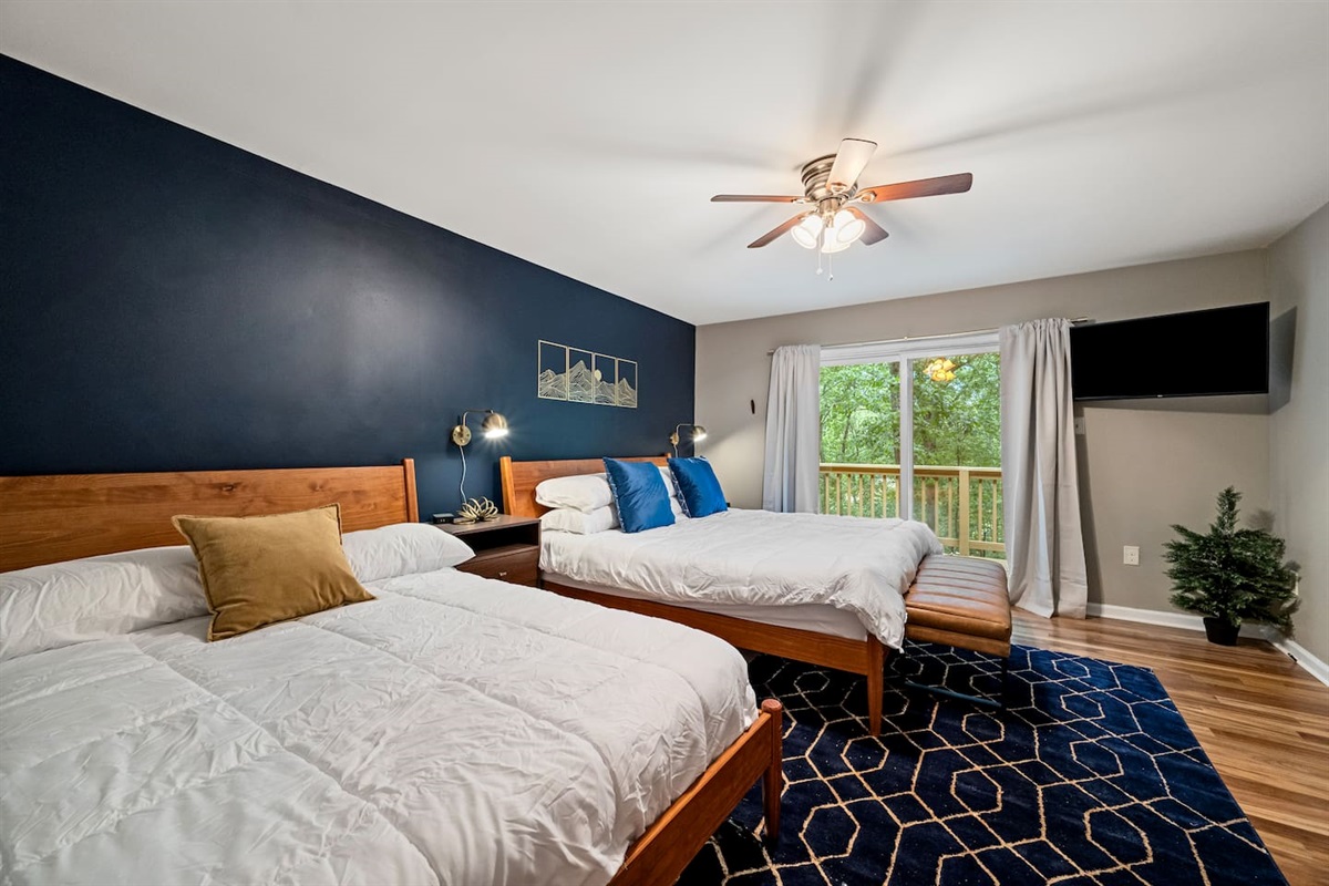 [Bedroom 2] - one king bed and one full bed.  Sliding glass door leads directly to a shared deck with bedroom 1.