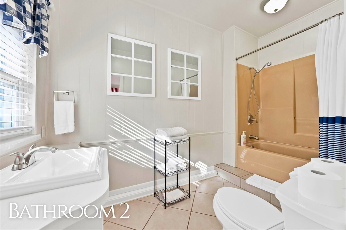 A clean and simple bathroom with a fresh, airy feel.