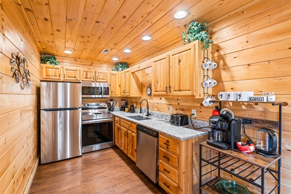 Full kitchen with coffee machine and tea kettle 