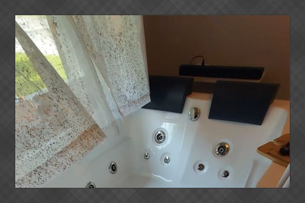 Luxe & Serene:  Enjoy the gentle bubbles of a heated jetted tub for two, designed for pure relaxation.