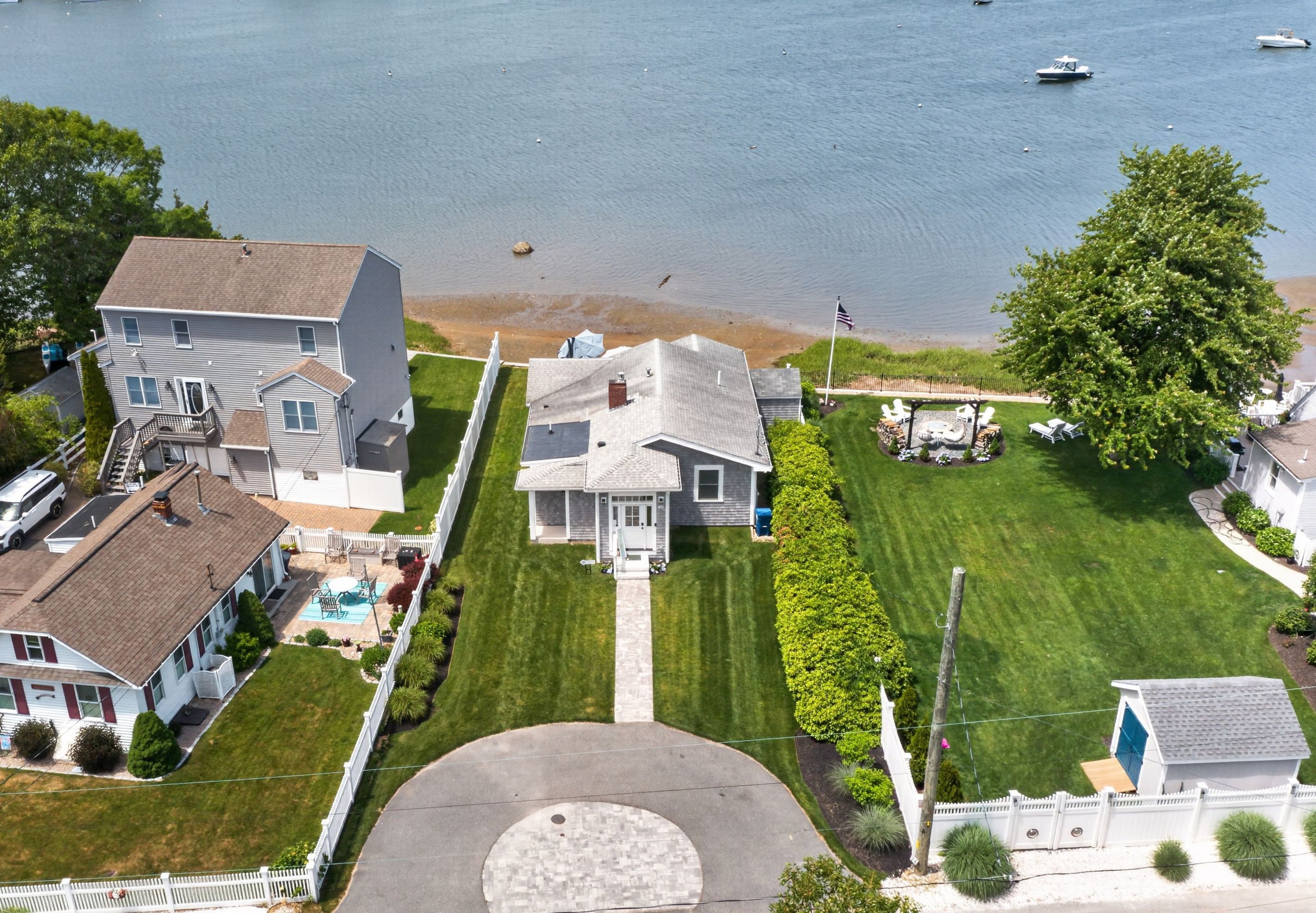 Aerial view showcasing the home's beautiful waterfront setting and scenic surroundings.