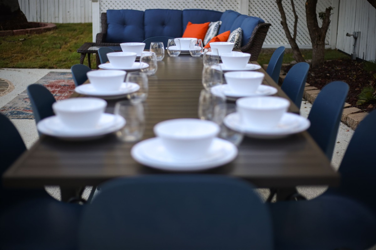 Spacious outdoor dining table with seating for up to 10 guests.