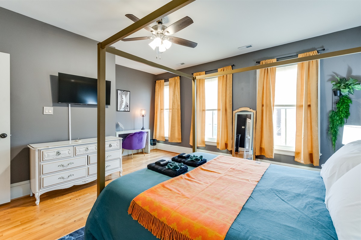 Queen Bedroom 2: Brighten your stay with sunlit windows and chic decor in this elegant escape!