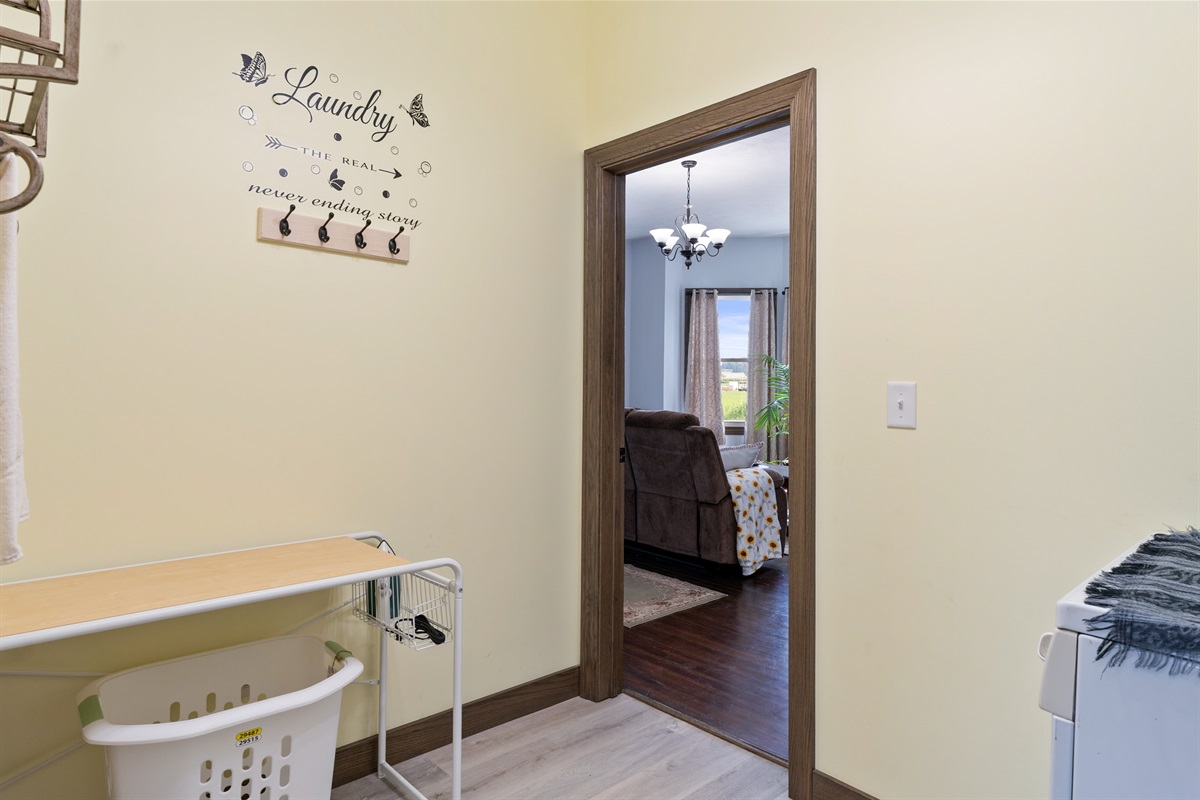 Convenient laundry space with easy access to the cozy living area for seamless daily living.