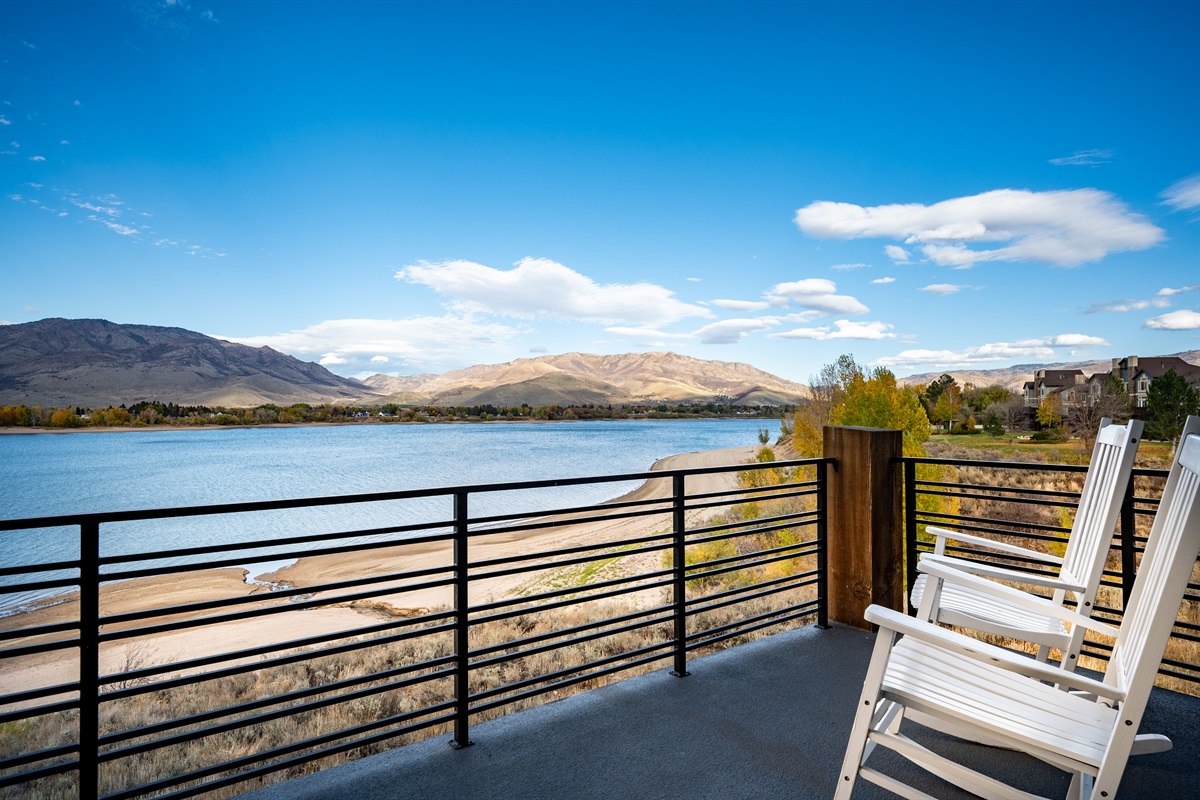 Upper-level balcony with breathtaking views of Pineview Reservoir and the Wasatch Mountains.