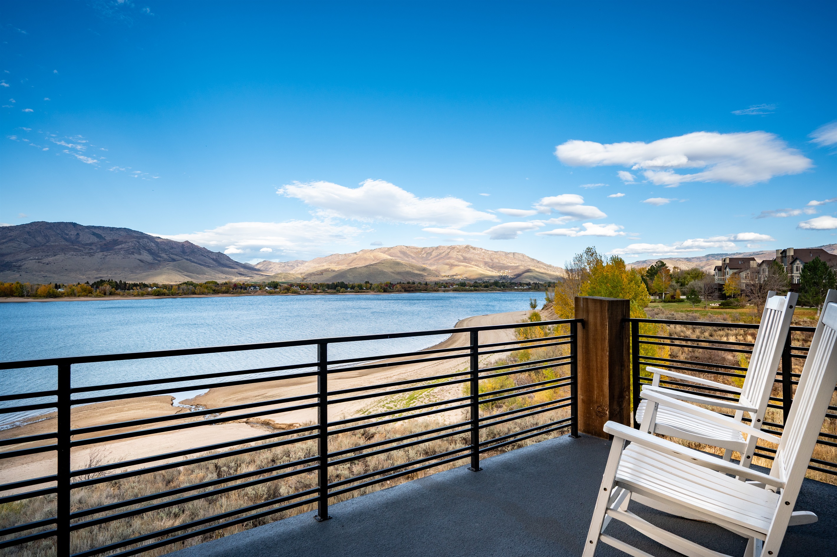 Upper-level balcony with breathtaking views of Pineview Reservoir and the Wasatch Mountains.