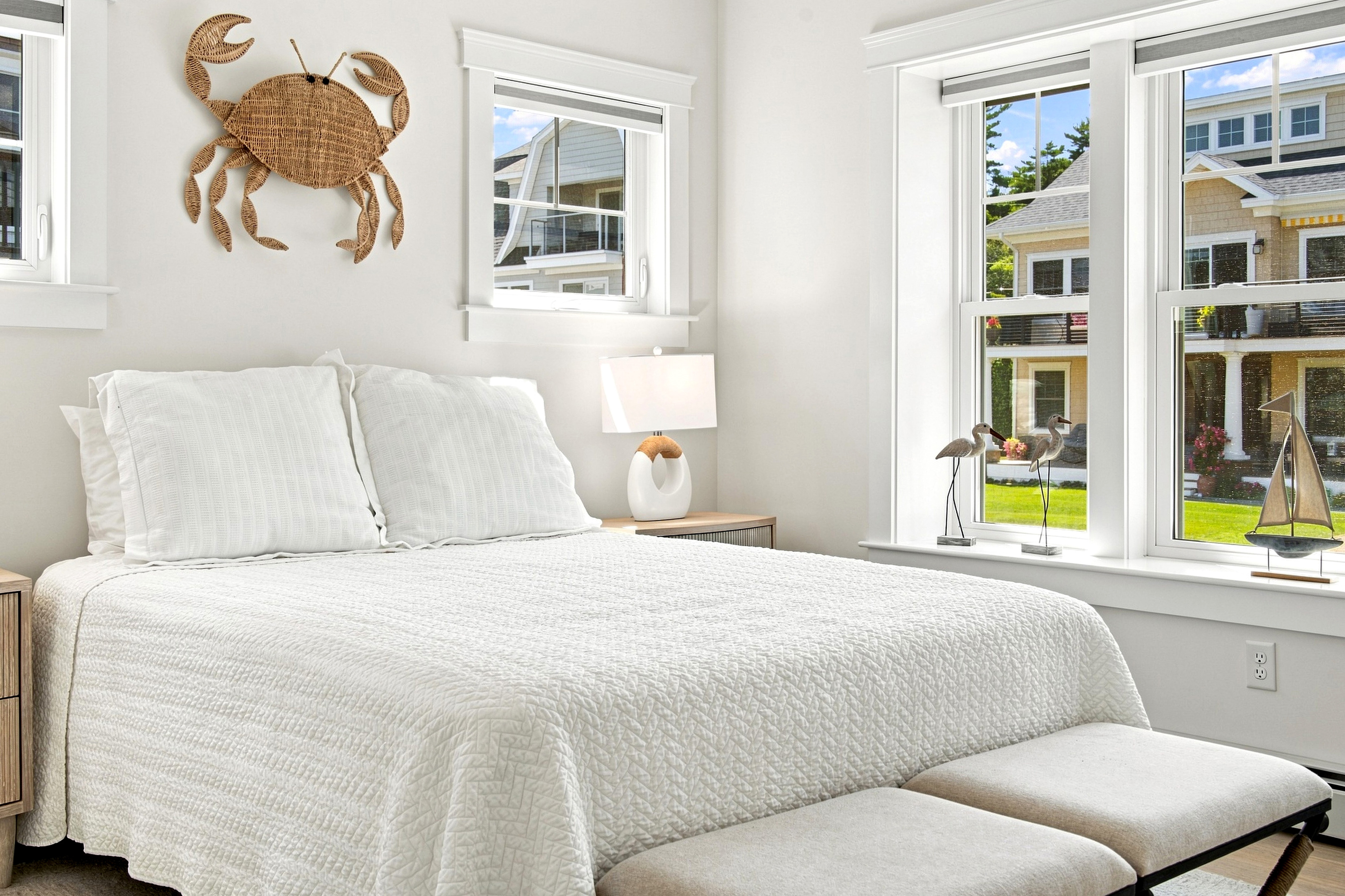 A cheerful, sun-filled bedroom offers a comfortable place to recharge after a full day by the shore.