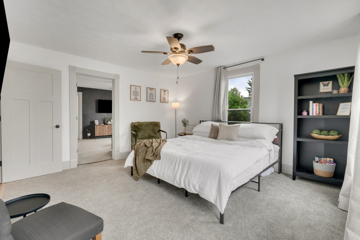 King room with room darkening curtains and extra bedding.
