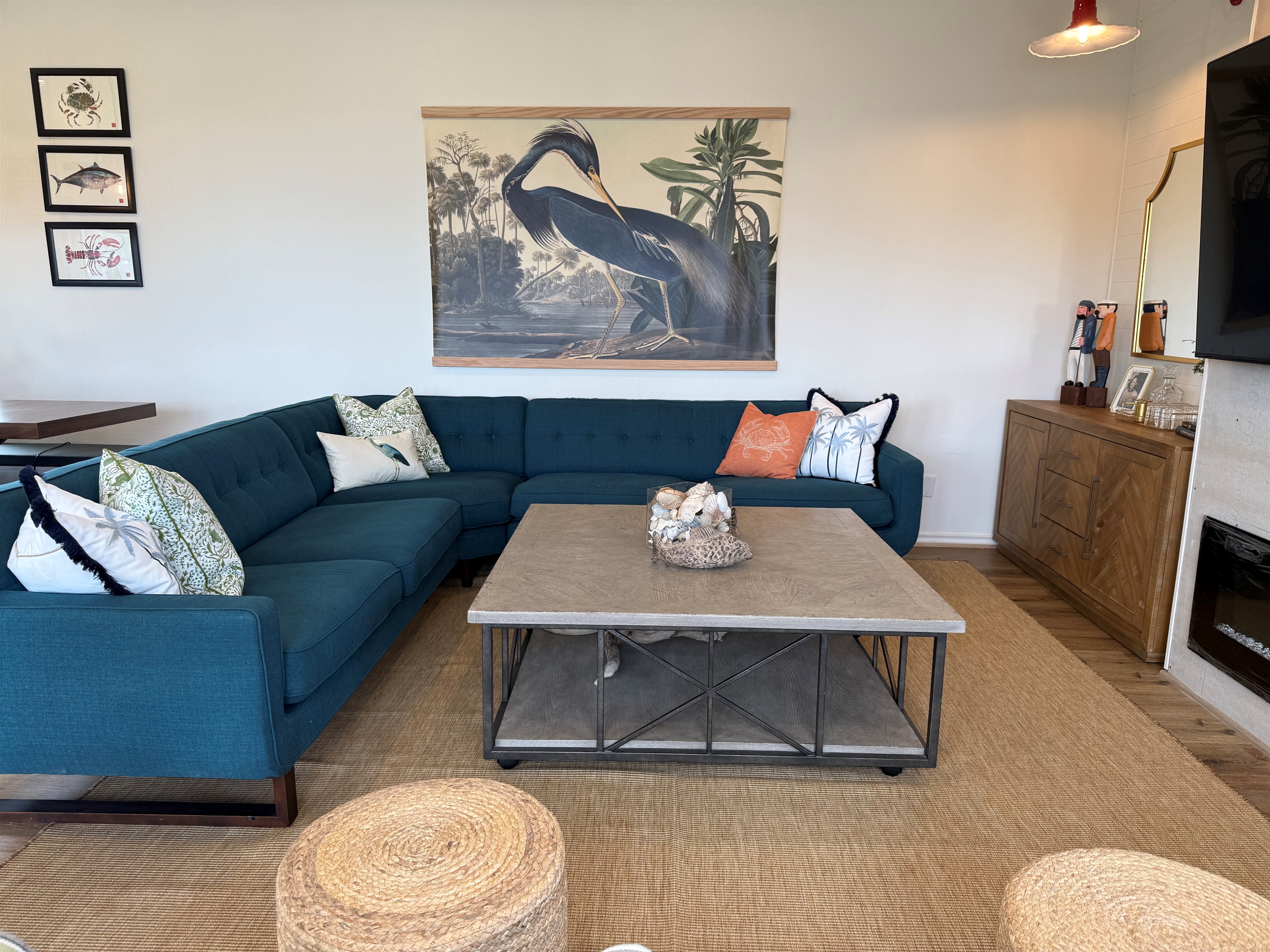 Several seats several to enjoy the 70" TV, electric fireplace, and bar at the side table. 