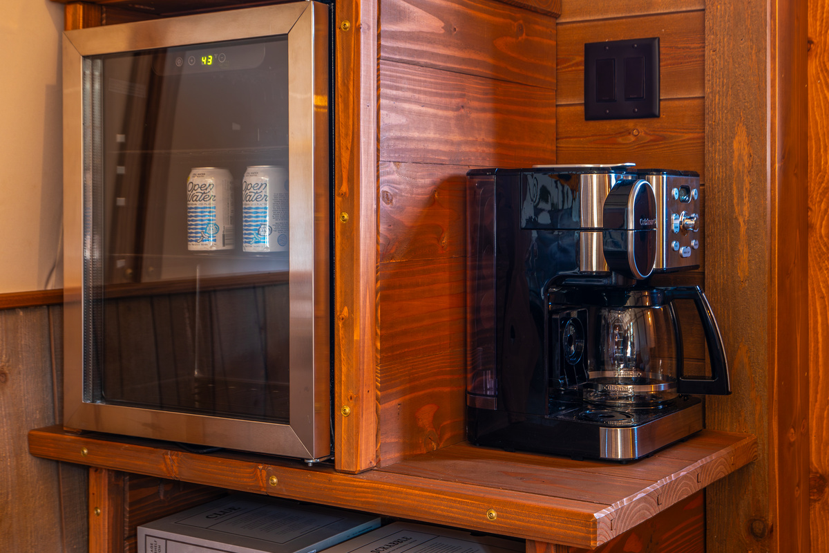 Coffee station, beverage fridge, microwave, cooler, and games for an easy couples getaway.