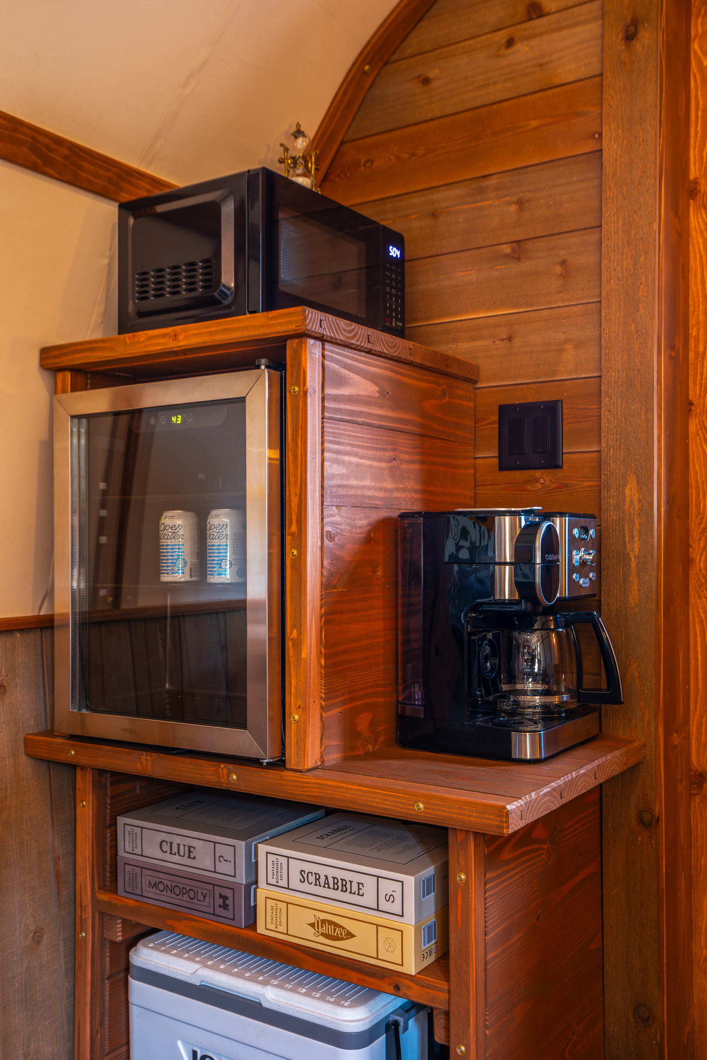 Coffee station, beverage fridge, microwave, cooler, and games for an easy couples getaway.