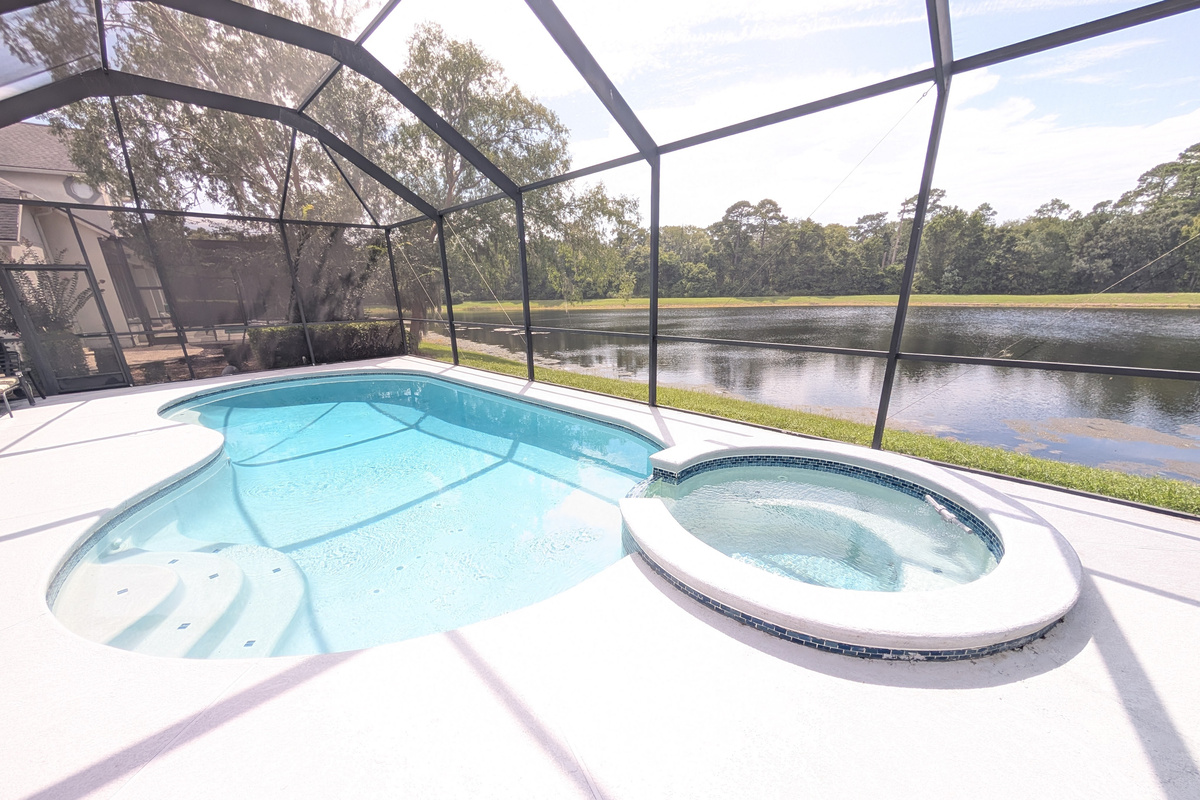 Private screened-in pool overlooking the peaceful pond &mdash; an ideal place to cool off and enjoy the Florida sunshine.