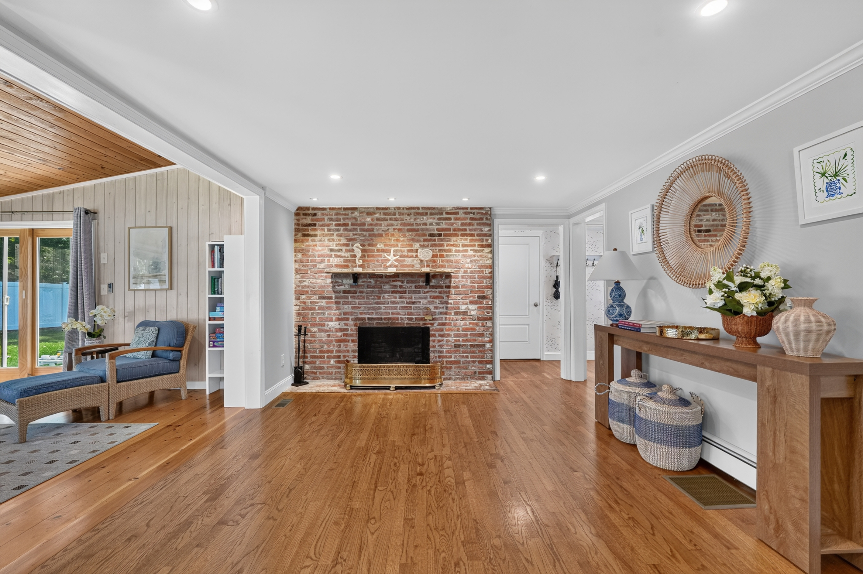 Warm and inviting living room featuring a classic brick fireplace.