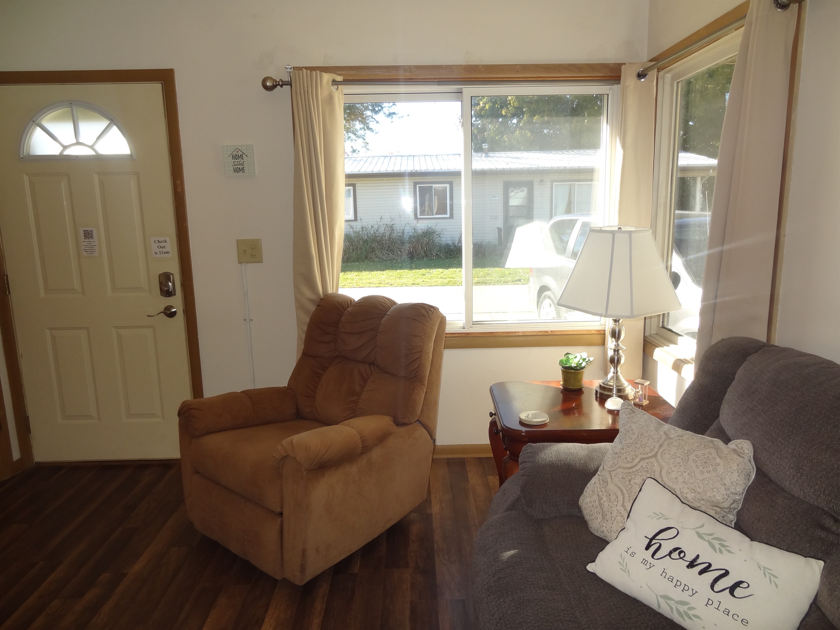 Living room with 2 recliners, reclining couch and Roku smart TV