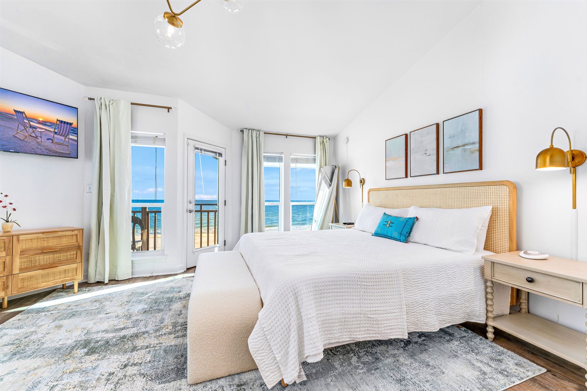 In the master bedroom located on the top level of the house, you can hear the soothing sounds of the waves even with the doors and windows closed, and enjoy watching dolphins swim as you sip your coffee from the bedroom deck.