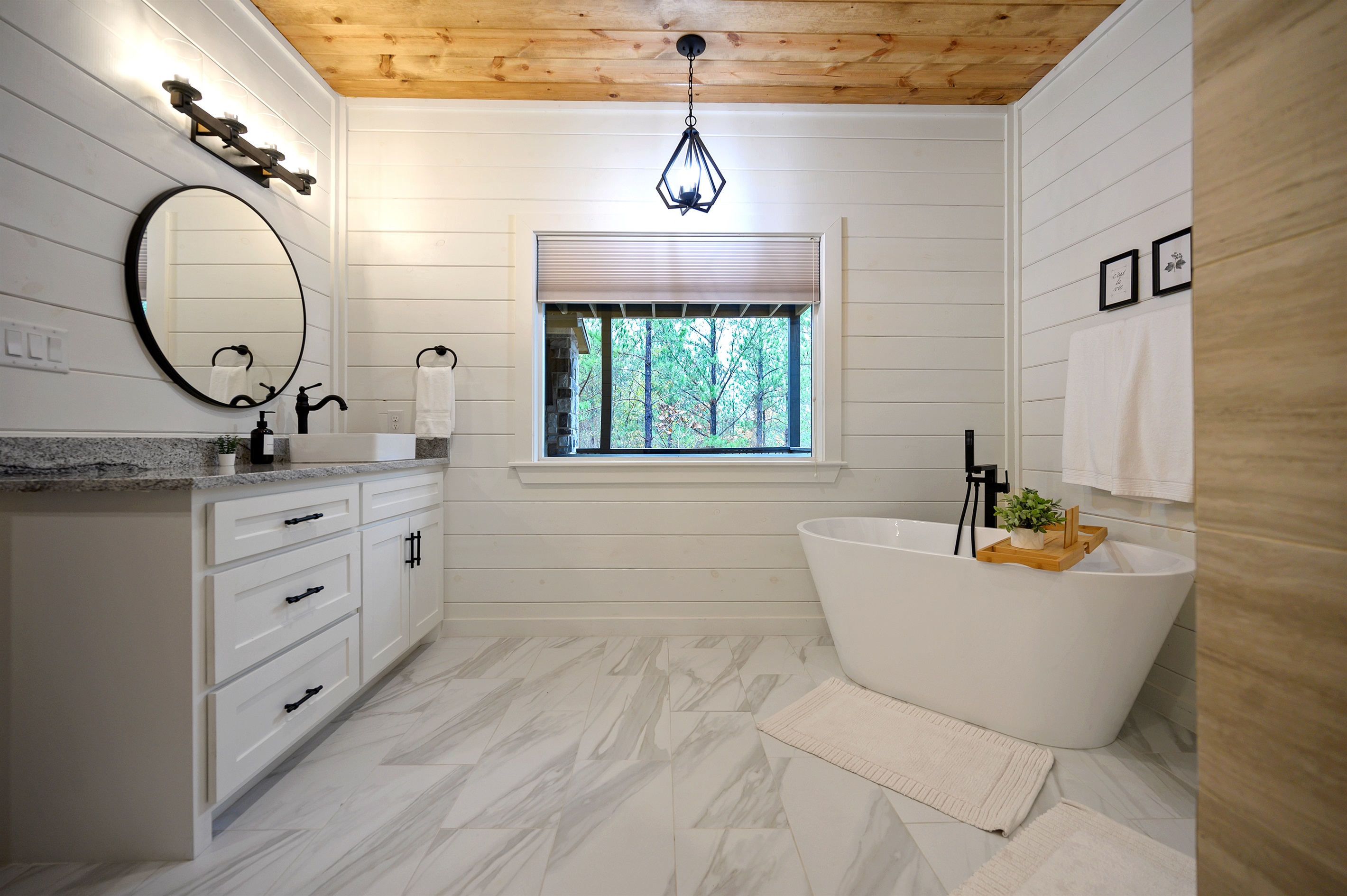 A king suite ensuite bathroom designed for relaxing beautifully. 
Featuring a soaking tub, spacious vanity, and calming spa inspired details that make unwinding feel effortless.