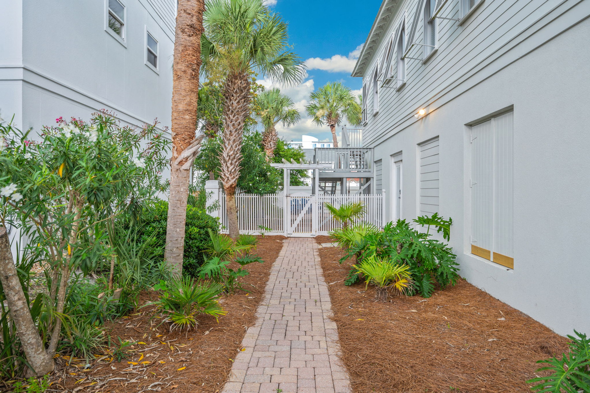 Path to 1st level living area entrance and the pool area
