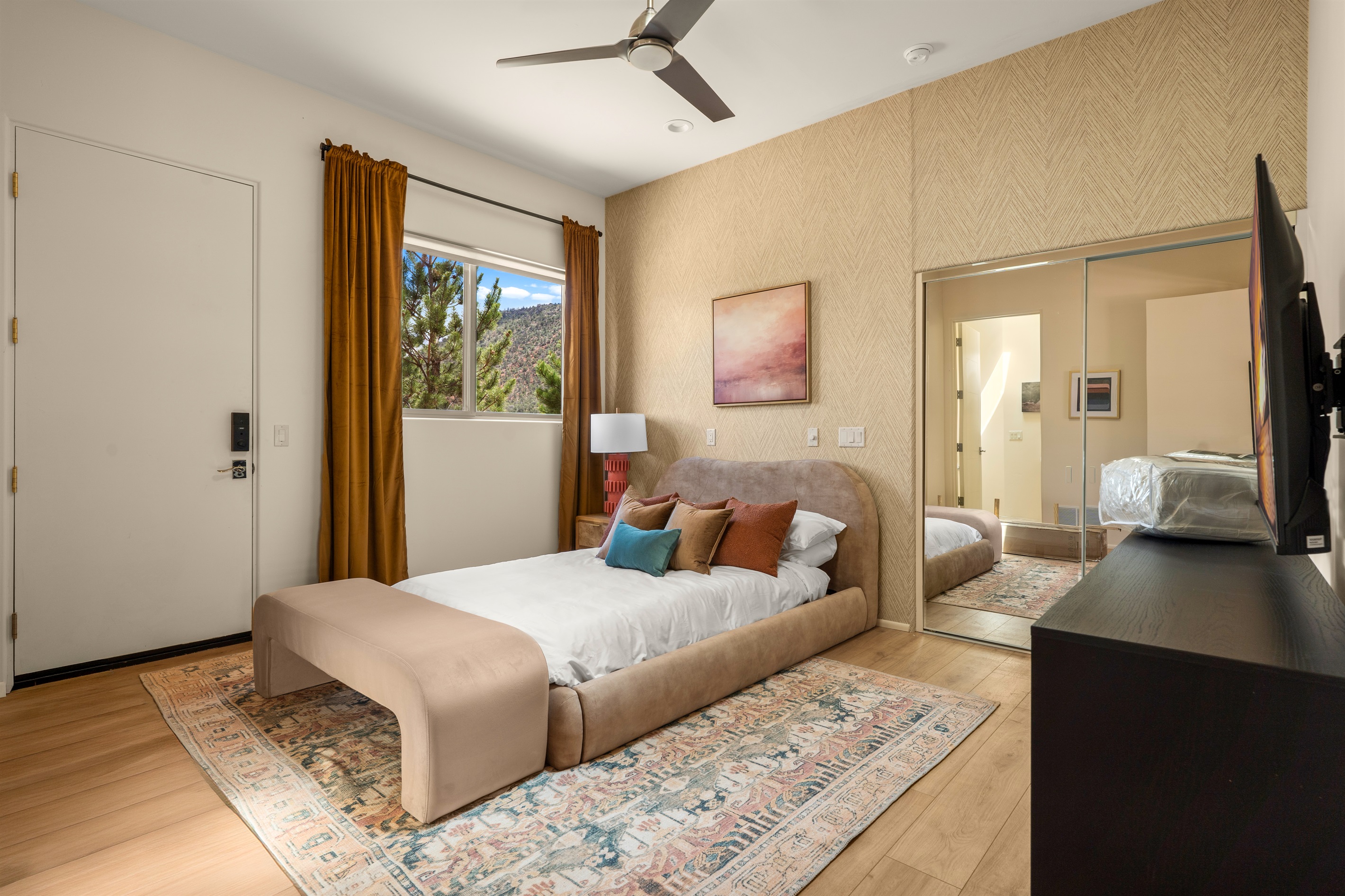 Relax in style. This thoughtfully appointed guest bedroom features premium bedding, a dedicated smart TV, and beautiful views of the Sedona landscape right from your window.