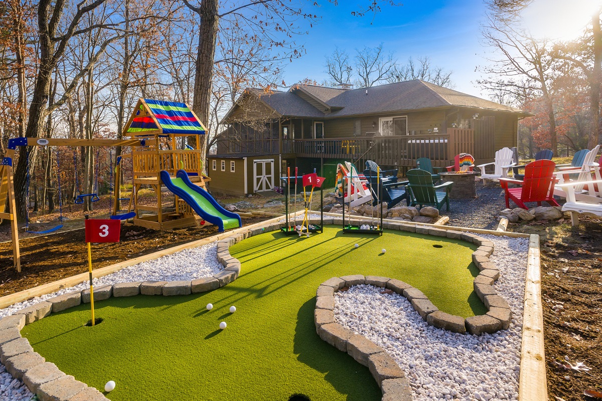 Your private outdoor playground — mini golf, swings, slides, and a big fire pit for s’mores under the trees.