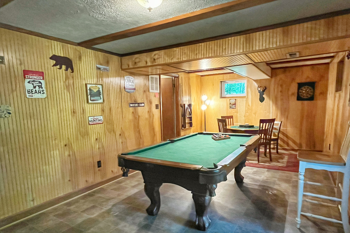 Relax downstairs with a game of pool or gather around the game table for cards, board games, or puzzles—the perfect spot to unwind after a day at the river.