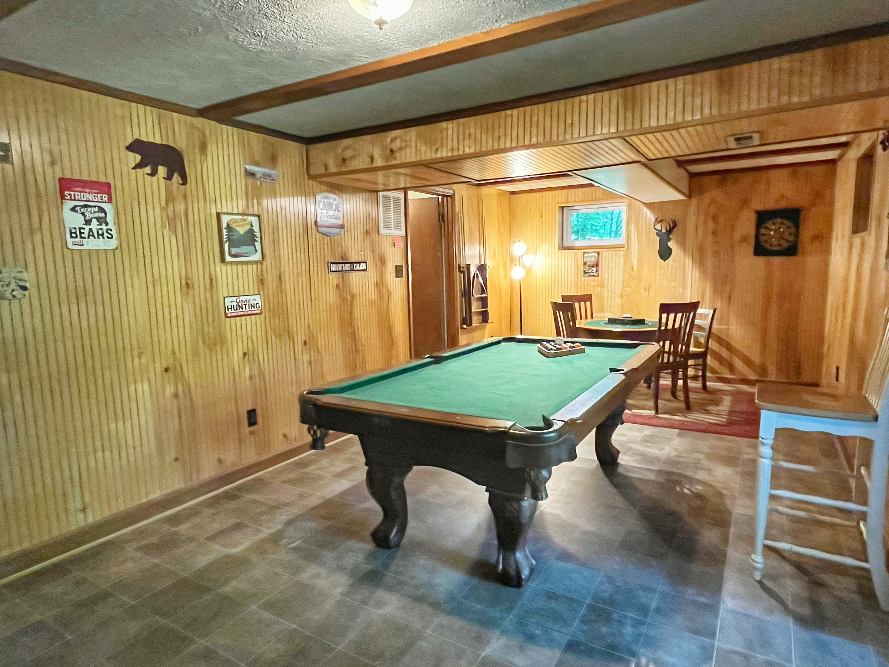 Relax downstairs with a game of pool or gather around the game table for cards, board games, or puzzles—the perfect spot to unwind after a day at the river.