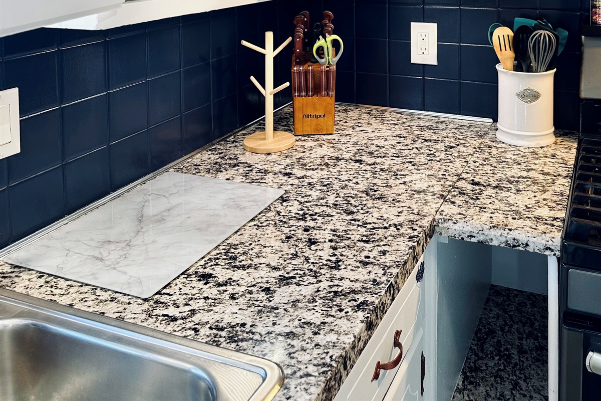 Dedicated kitchen cabinet with assorted food storage containers and lids, making leftovers and meal prep simple and organized.