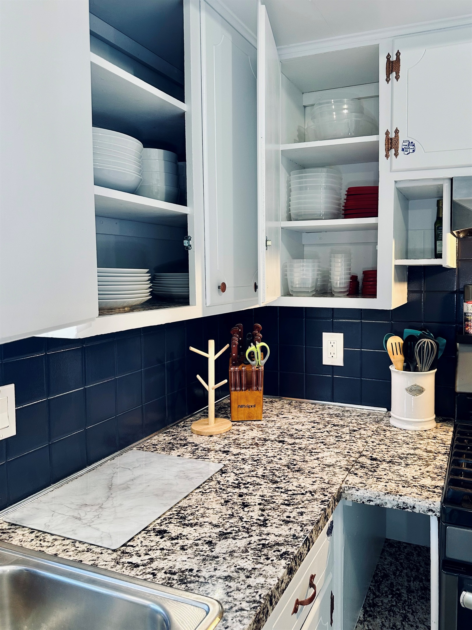 Dedicated kitchen cabinet with assorted food storage containers and lids, making leftovers and meal prep simple and organized.