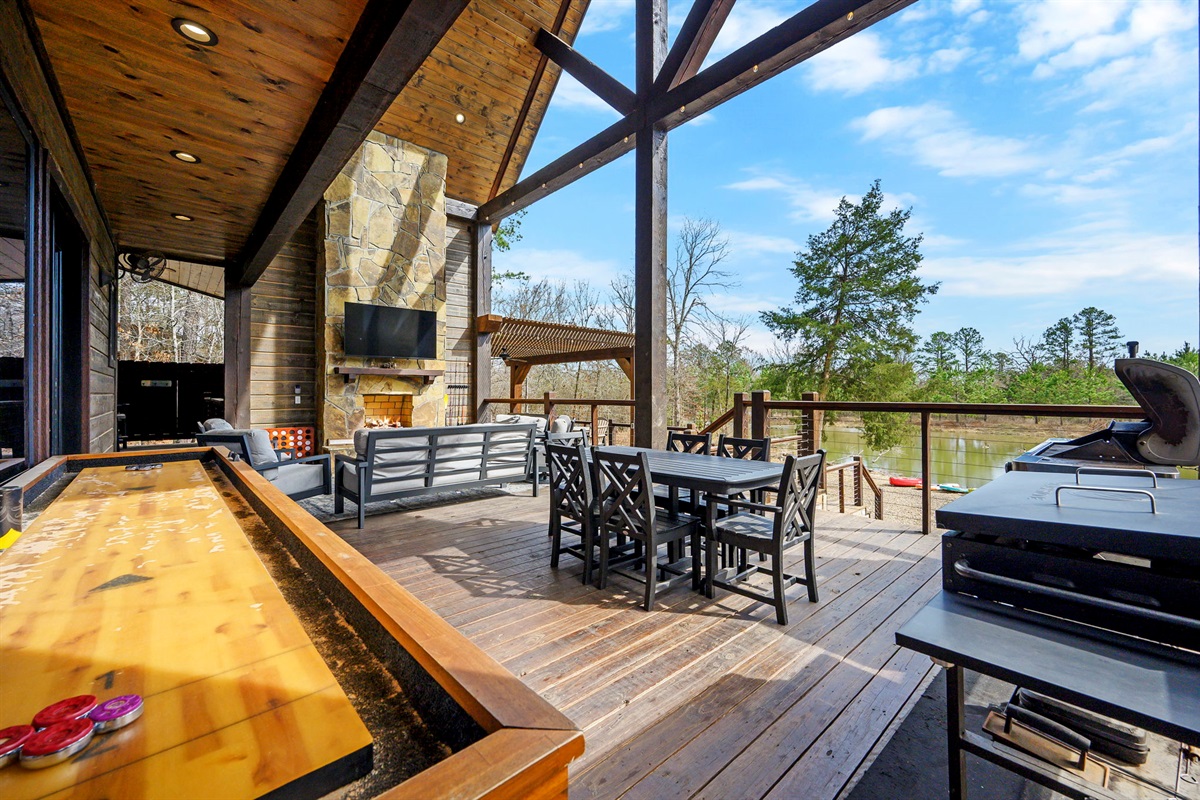 Take the fun outdoors with a friendly round of shuffleboard on the covered deck—fresh air, forest views, and a little friendly competition make the perfect combo.