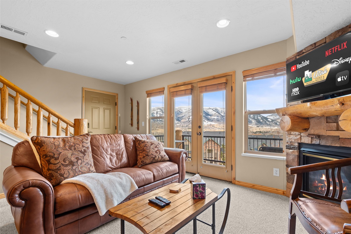 Comfortable living space designed for unwinding, featuring plush seating and warm mountain-lodge charm.