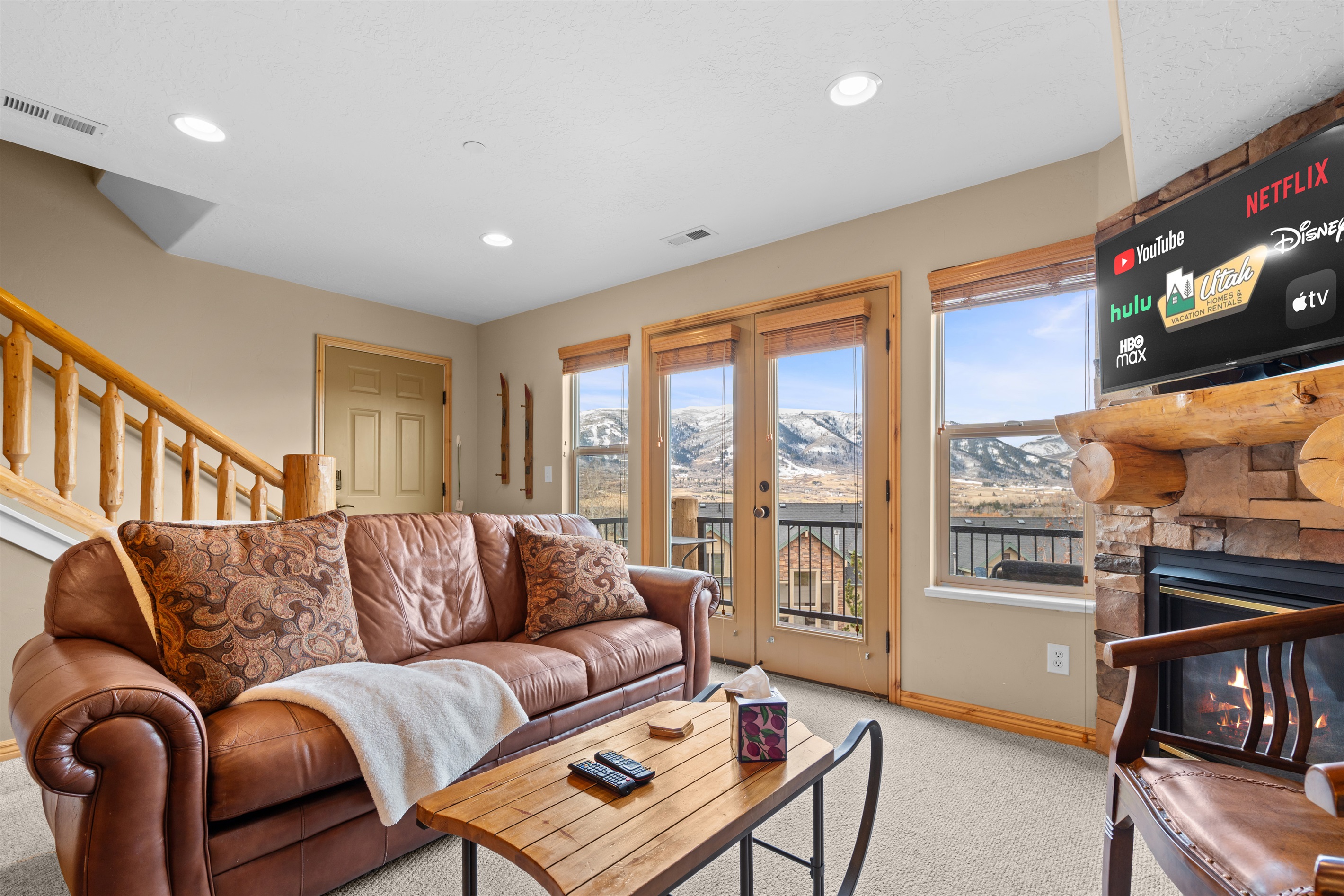 Comfortable living space designed for unwinding, featuring plush seating and warm mountain-lodge charm.