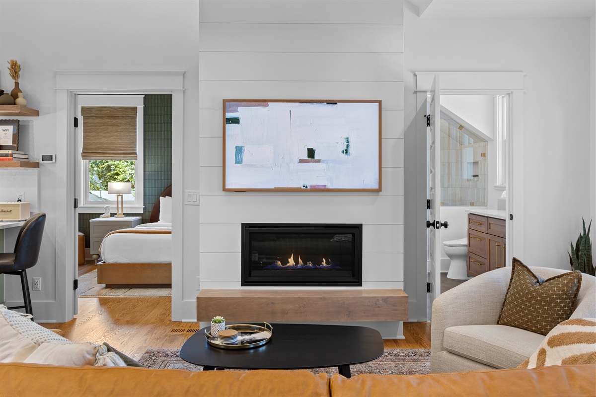 Gas fireplace and Smart (art) TV at the heart of the living room.