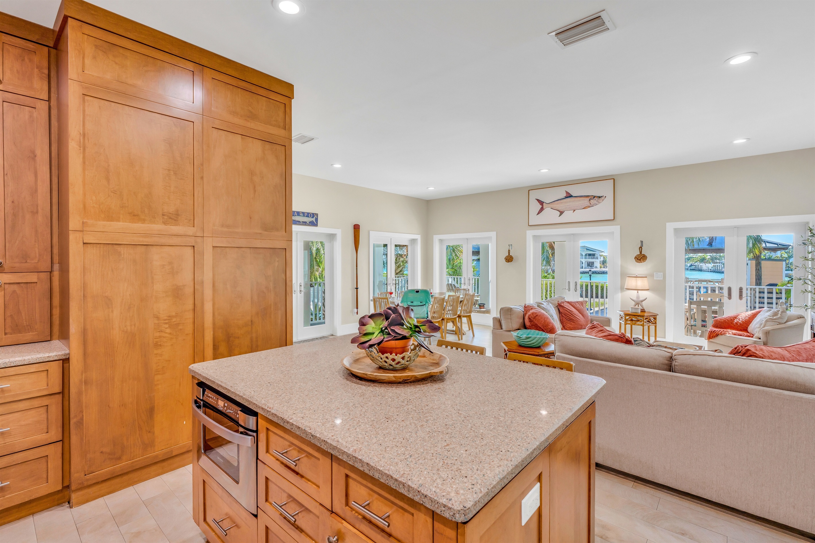 The open floor plan keeps the cook in the conversation.