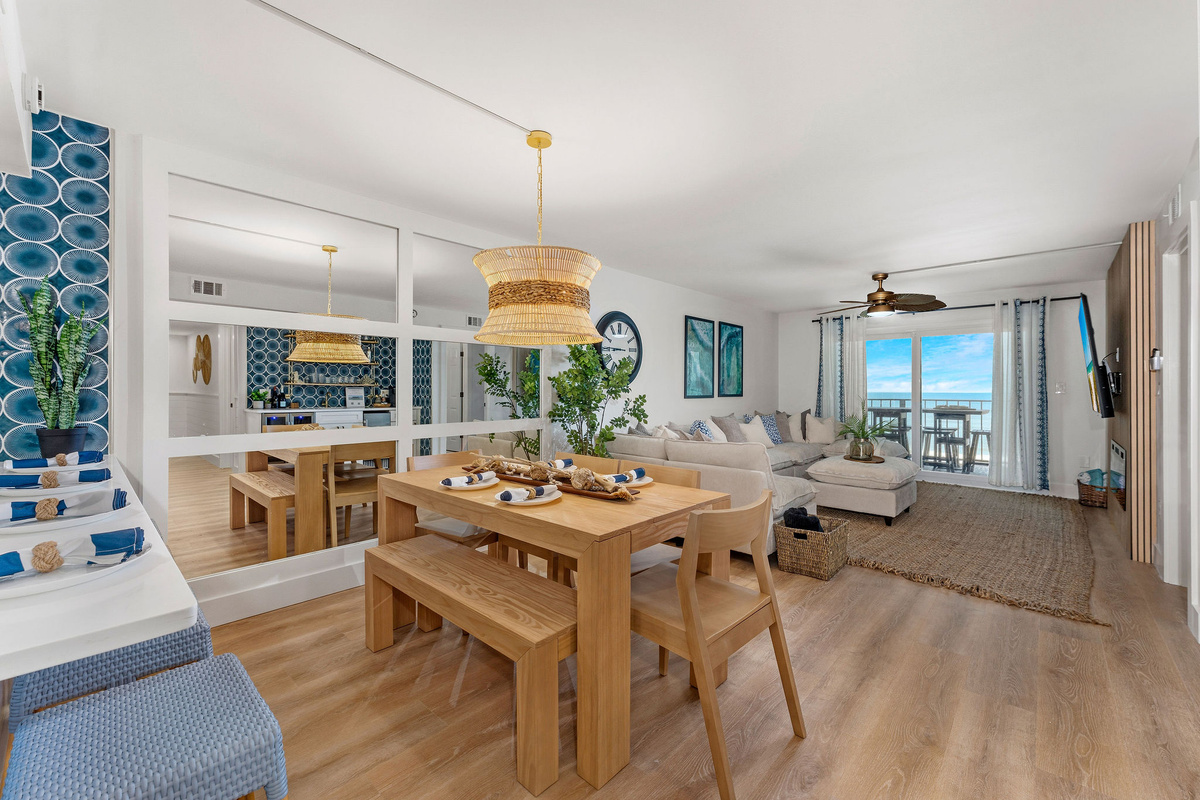 The large dining table seats six comfortably for family meals. It is a great spot to gather after a day of exploring. Additional four barstools offer seating for up to ten guests.