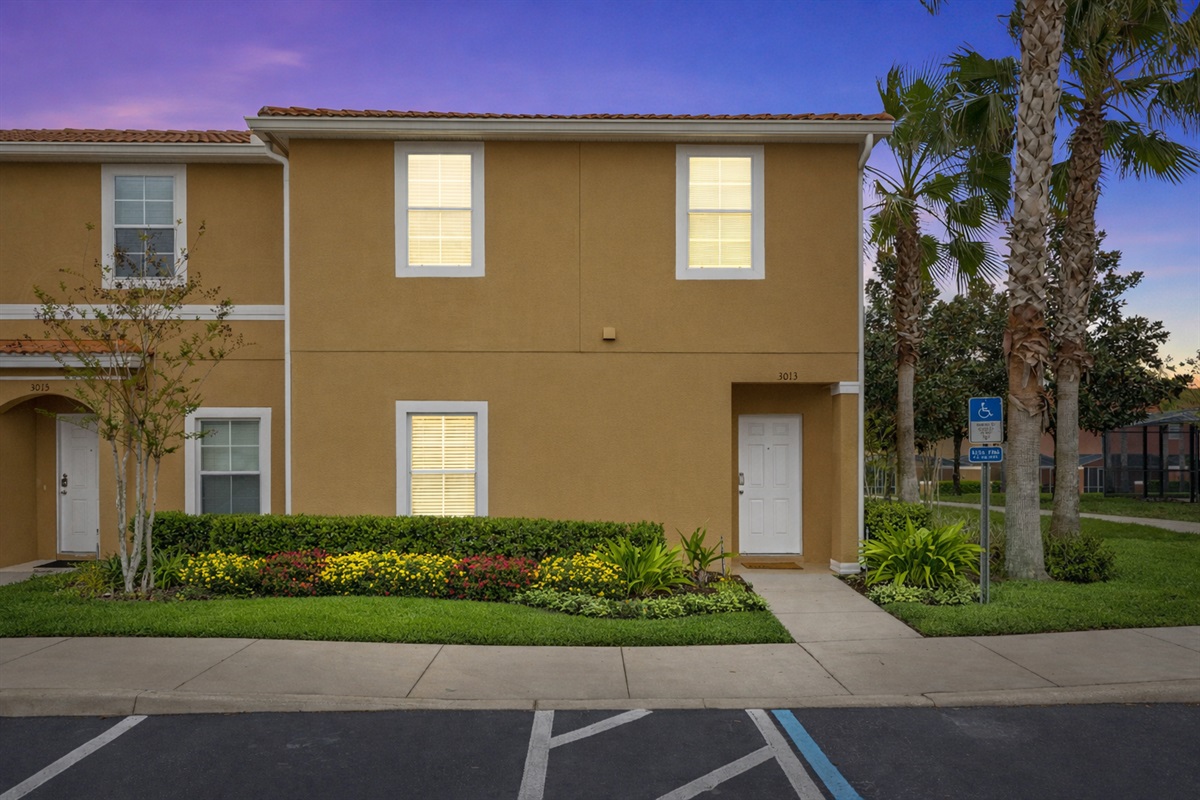 Exterior view of the townhome with convenient parking near the front door