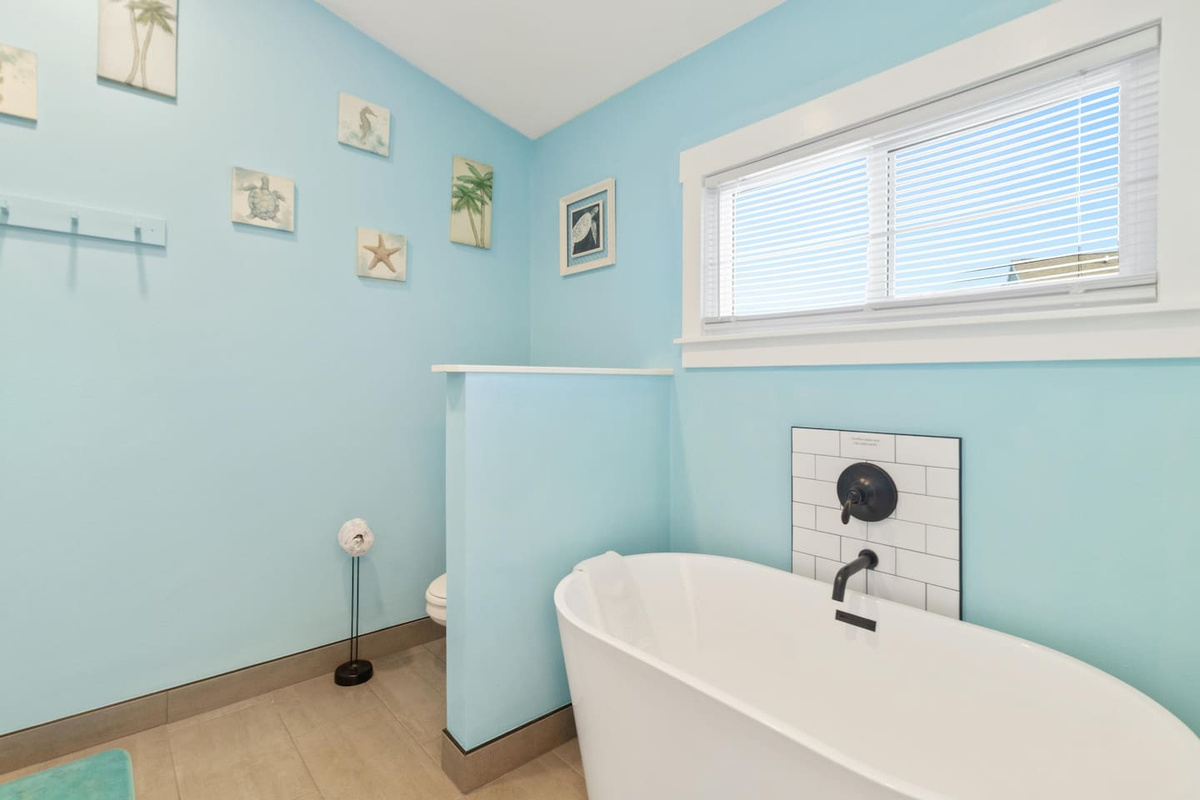 Soak away a long beach day in your private soaking tub &mdash; this is the master bath detail guests always mention in reviews.