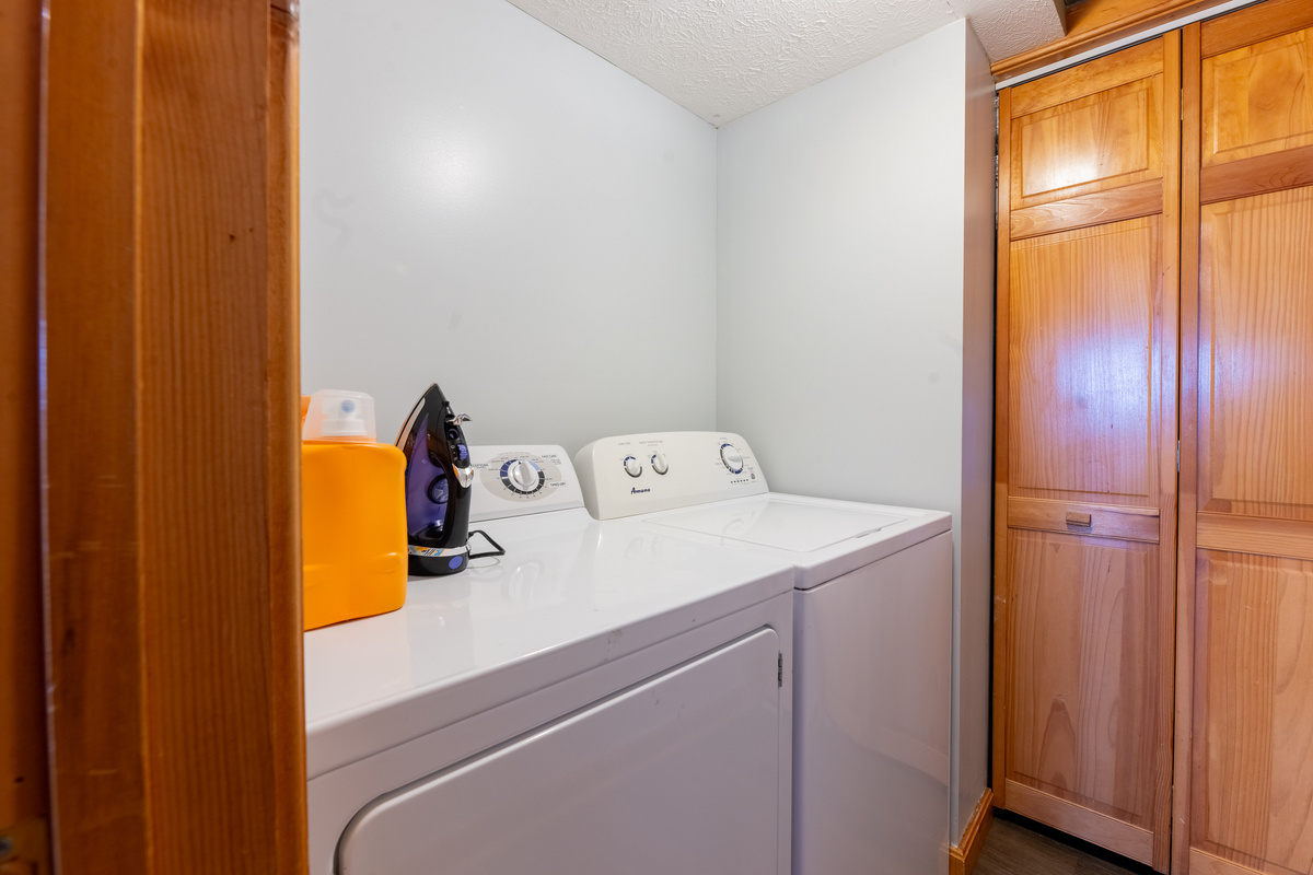 In unit laundry room with washer and dryer