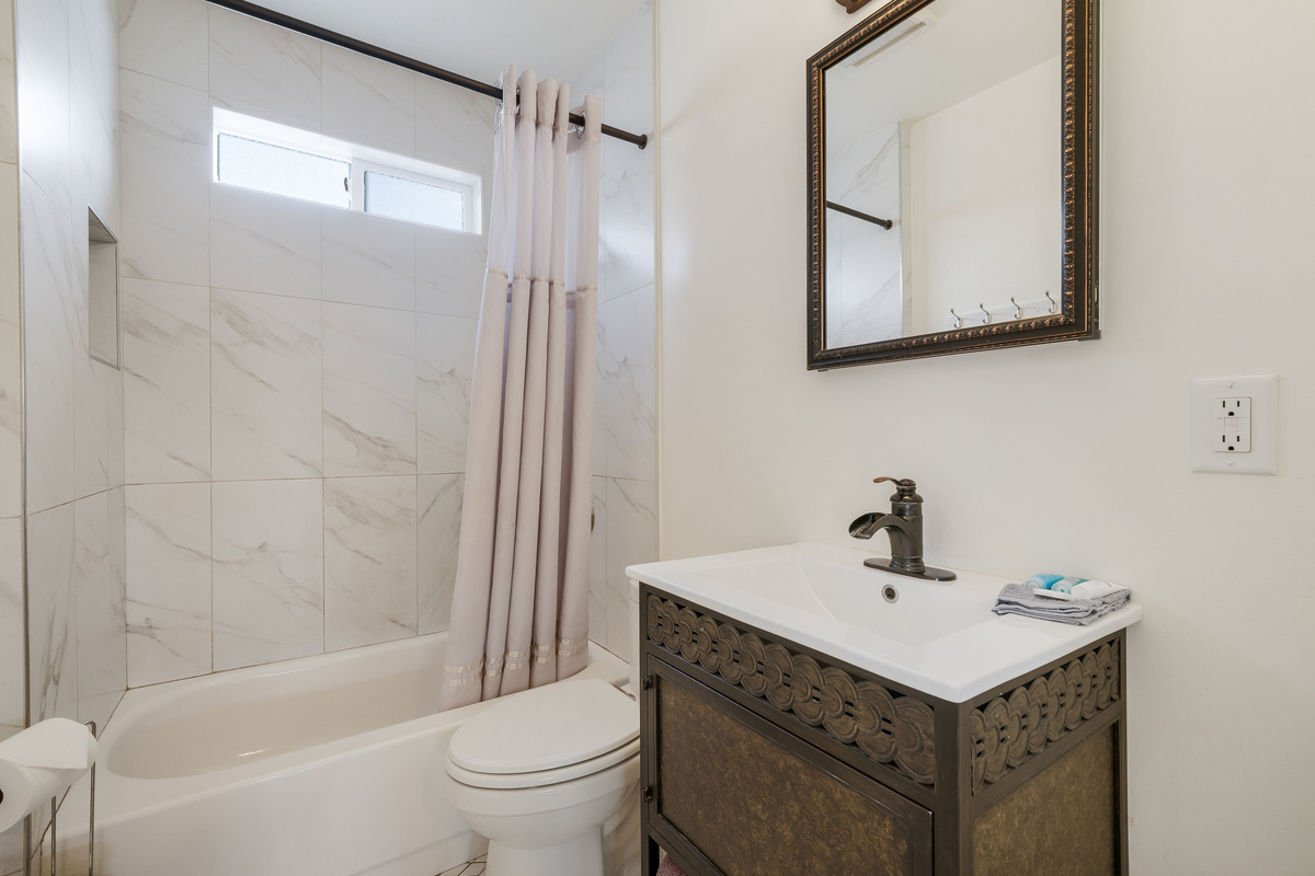 There is a bath-and-shower combination in the bathroom.