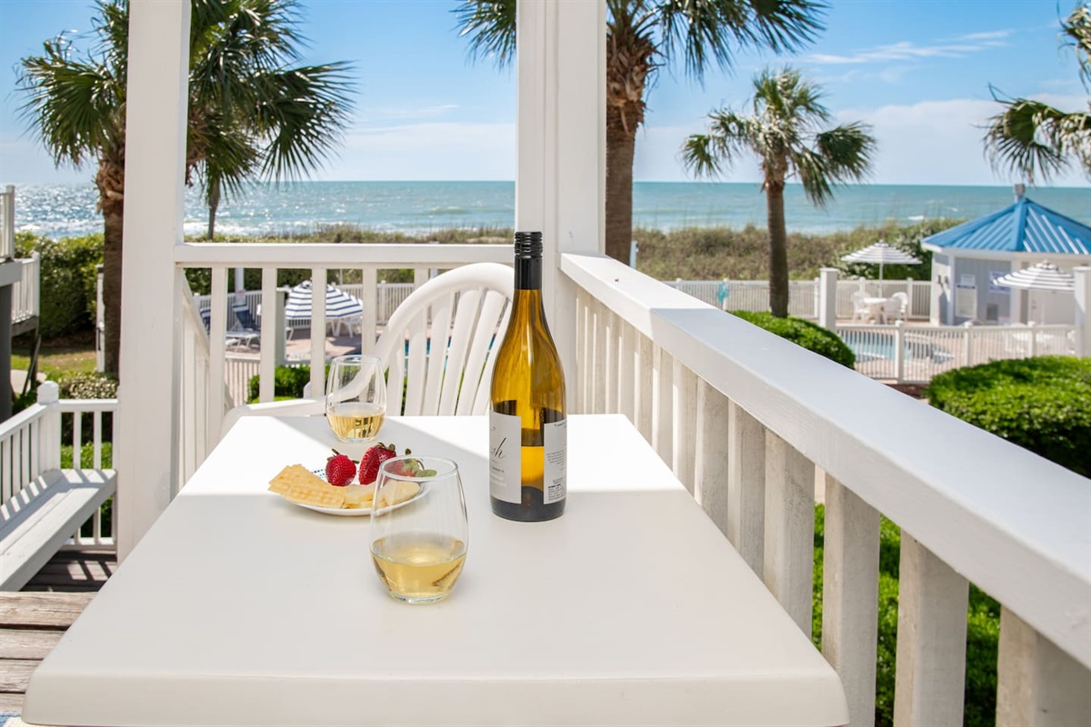 Relax and Enjoy the sights and sounds on the oceanfront porch at Portofino 1424.  