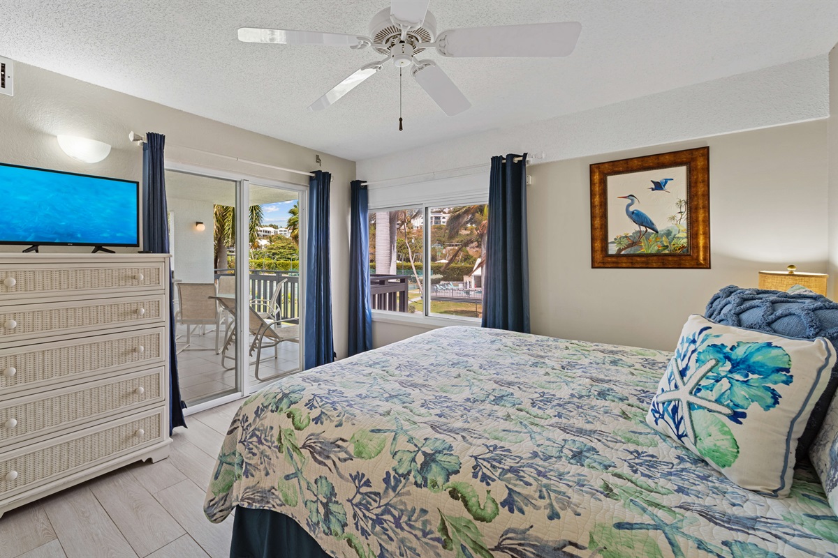 Comfortable king bedroom with serene island vibes.