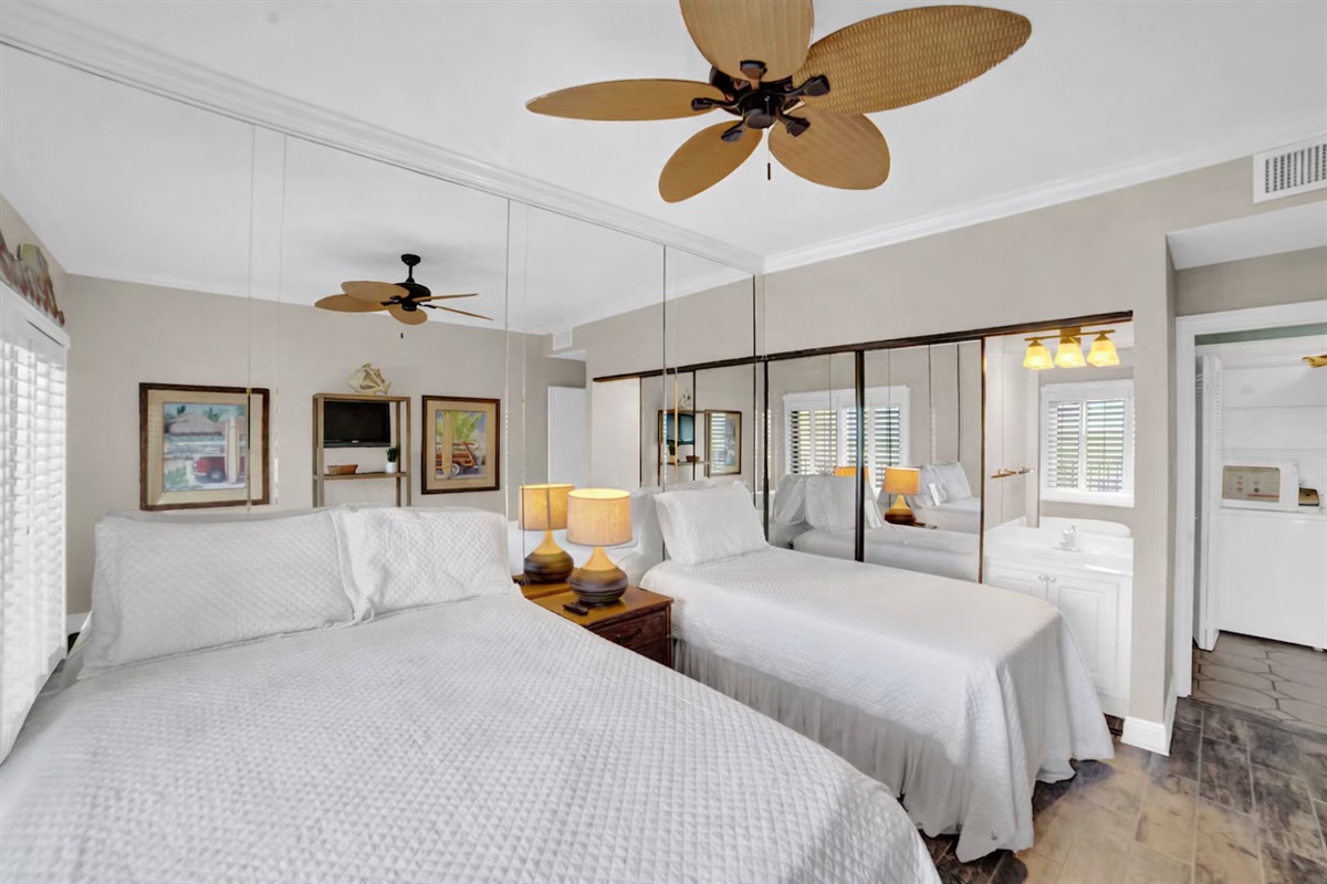 Guest bedroom will accommodate 3 guests. I will be removing the mirror wall, putting a new fan with light kit in, wall mounting a smart tv and a vanity. This room has direct access to a private balcony that is only accessed through this room.  