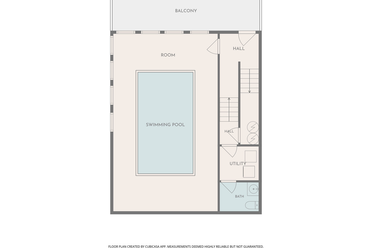 Head back down to the bottom level with the large swimming pool and conveniently located bathroom.