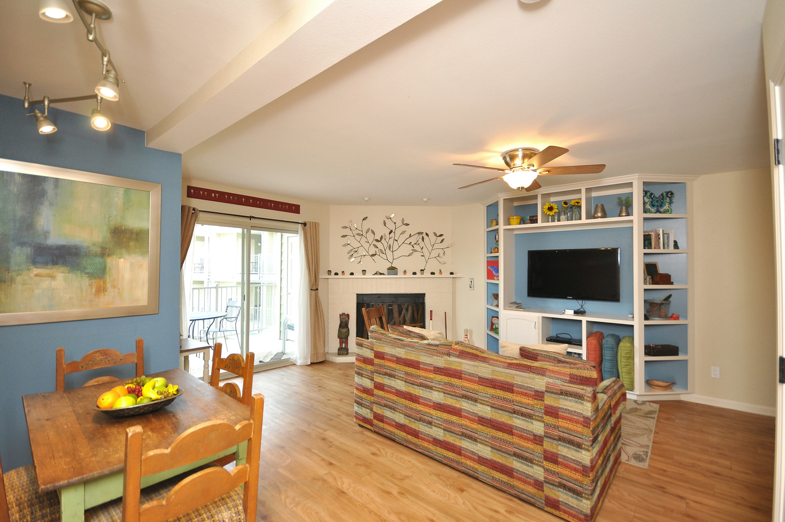 Living area with door leading to balcony