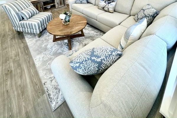 Relax in this cozy living room with comfortable seating for 6