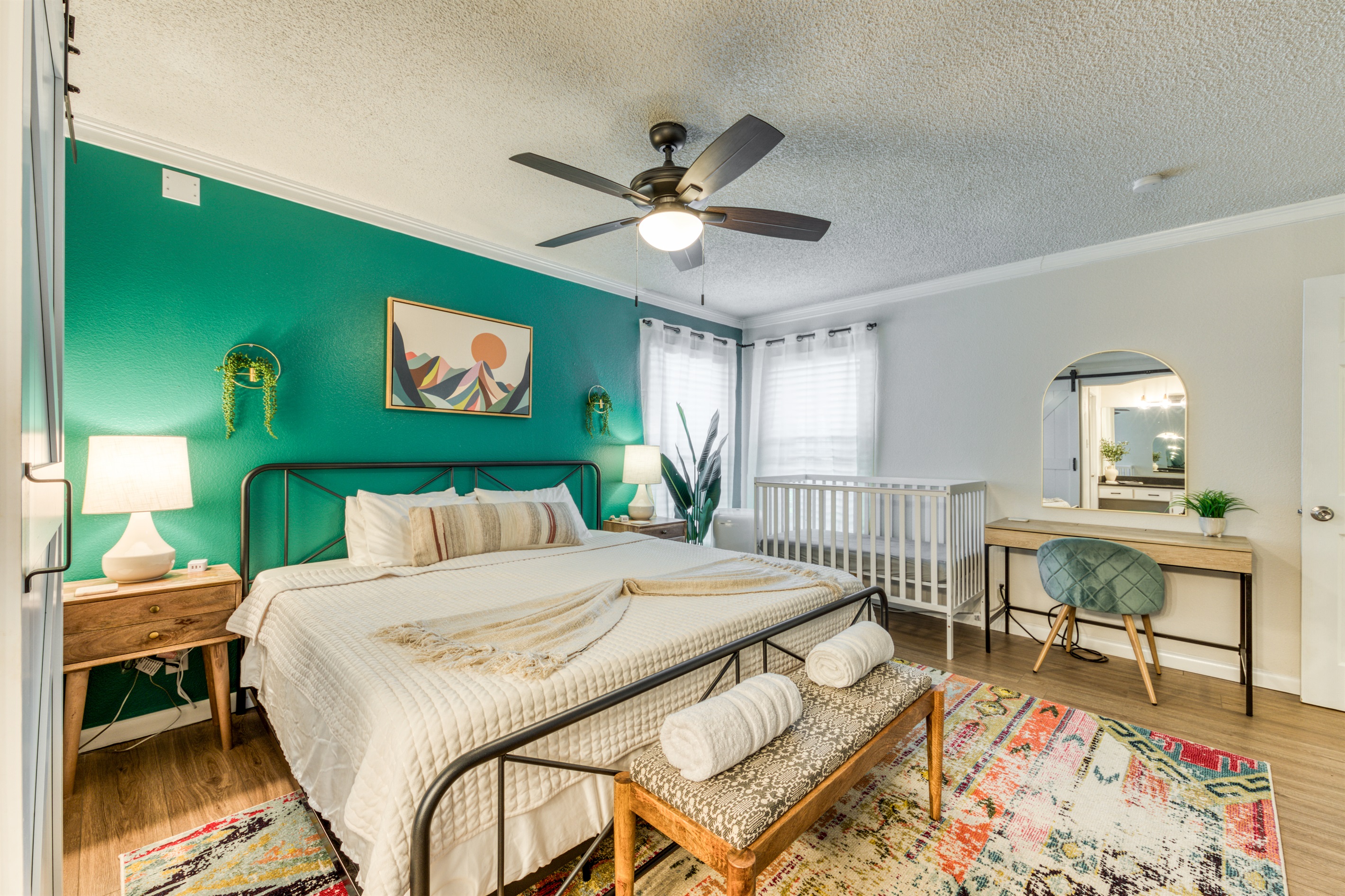 Master bedroom with king bed, crib