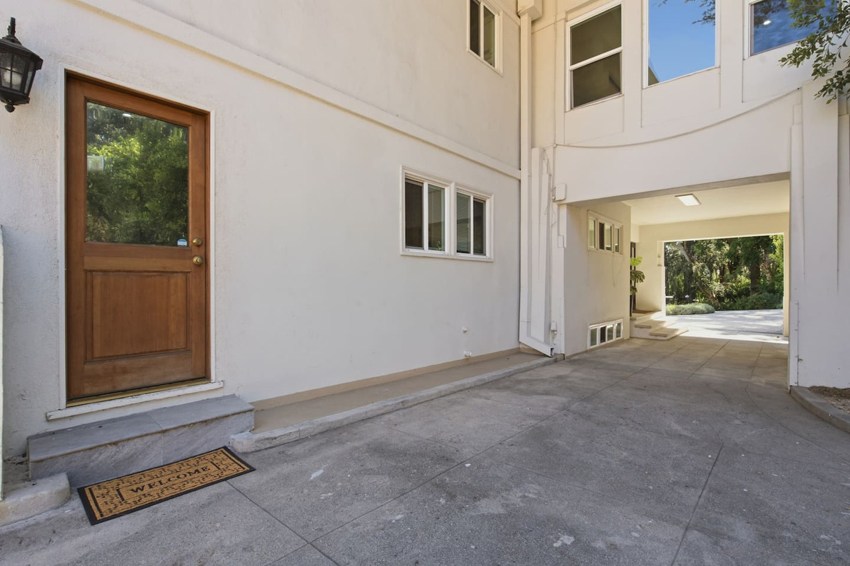 Guest-facing perspective showing the steps leading to the door and the surrounding entrance area.