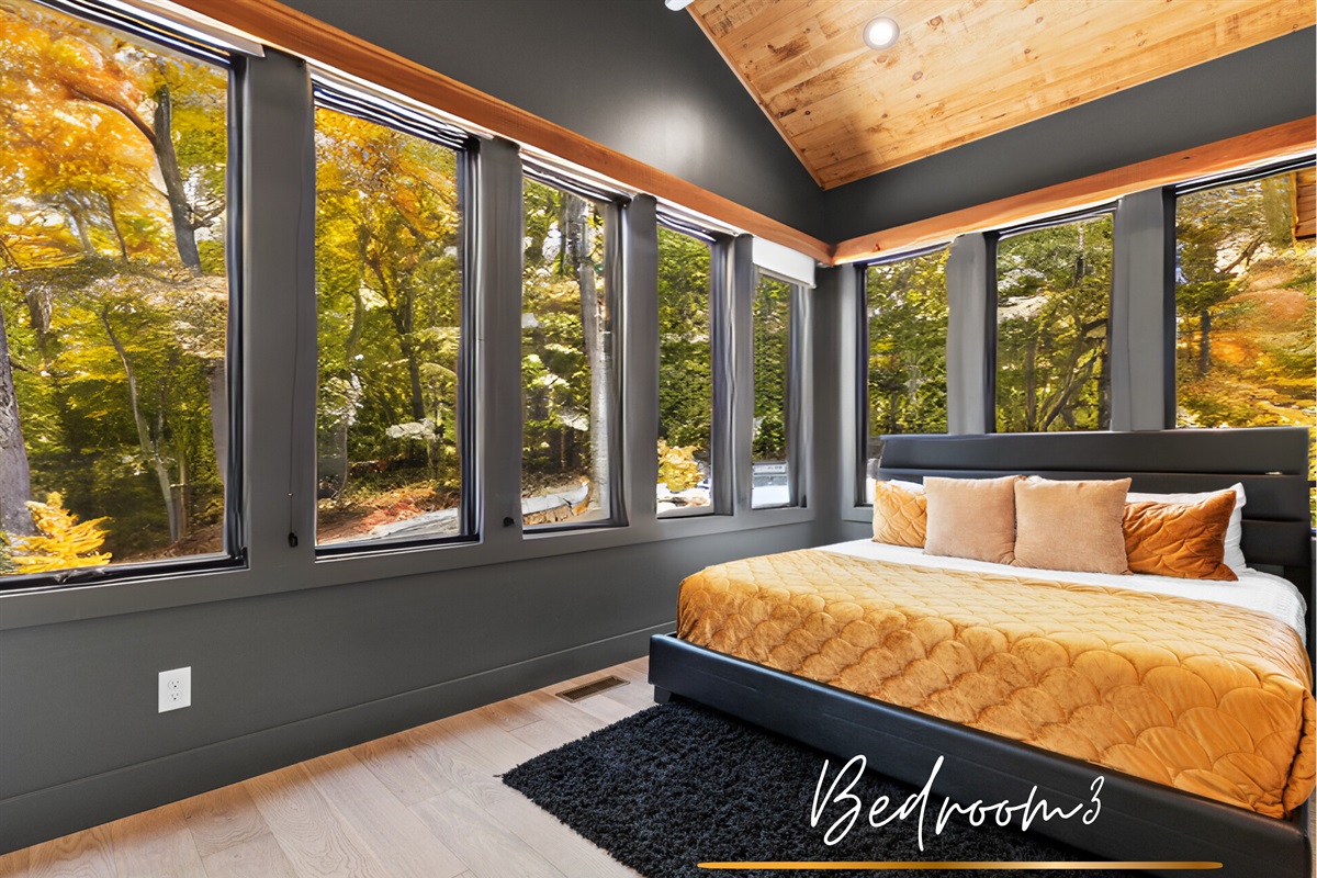 The third bedroom features a twin bed, offering both style and comfort with vibrant tones and natural light.