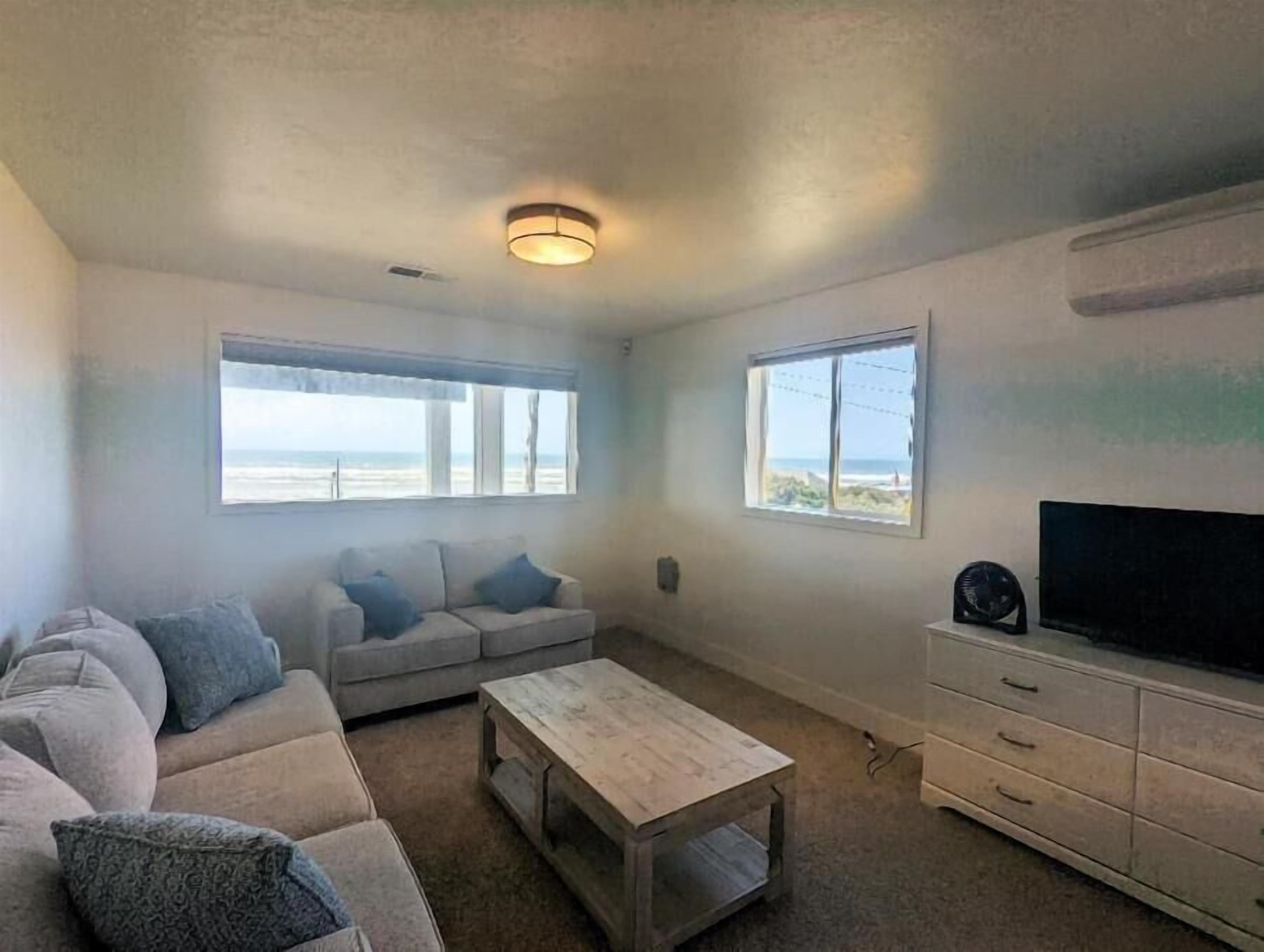 Bunk Room with sofas and TV