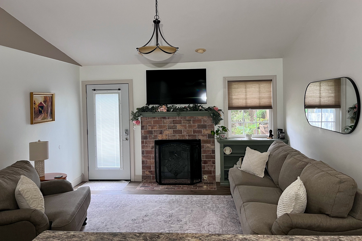 The large living room is open to the kitchen area. That means that everyone will be included in the conversation while dinner prep happens.