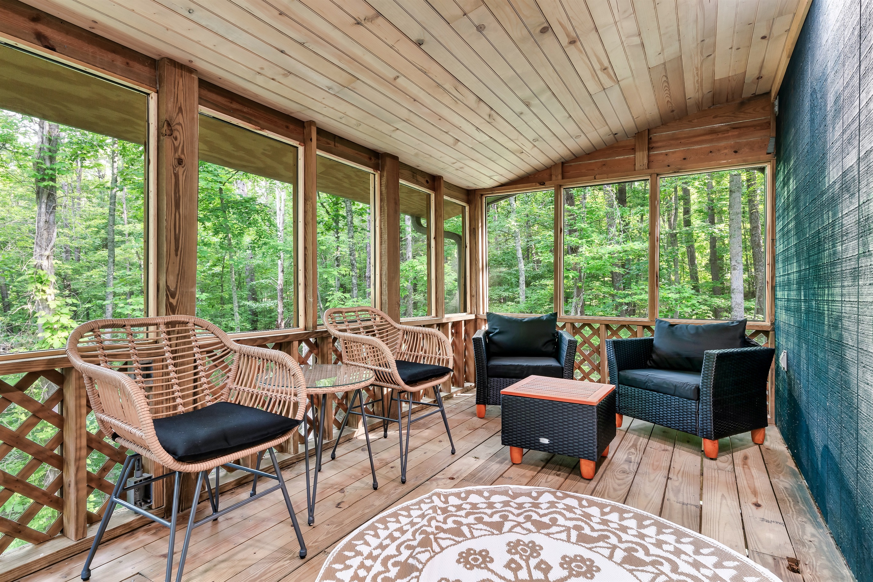 Your year-round mountain retreat! This spacious screened porch is the perfect spot to relax and enjoy the sights and sounds of the forest, rain or shine.